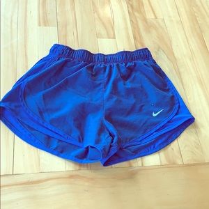 Nike blue Dri-Fit athletic shorts.